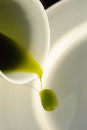Pouring of Extra Virgin Olive Oil by Ashbolt